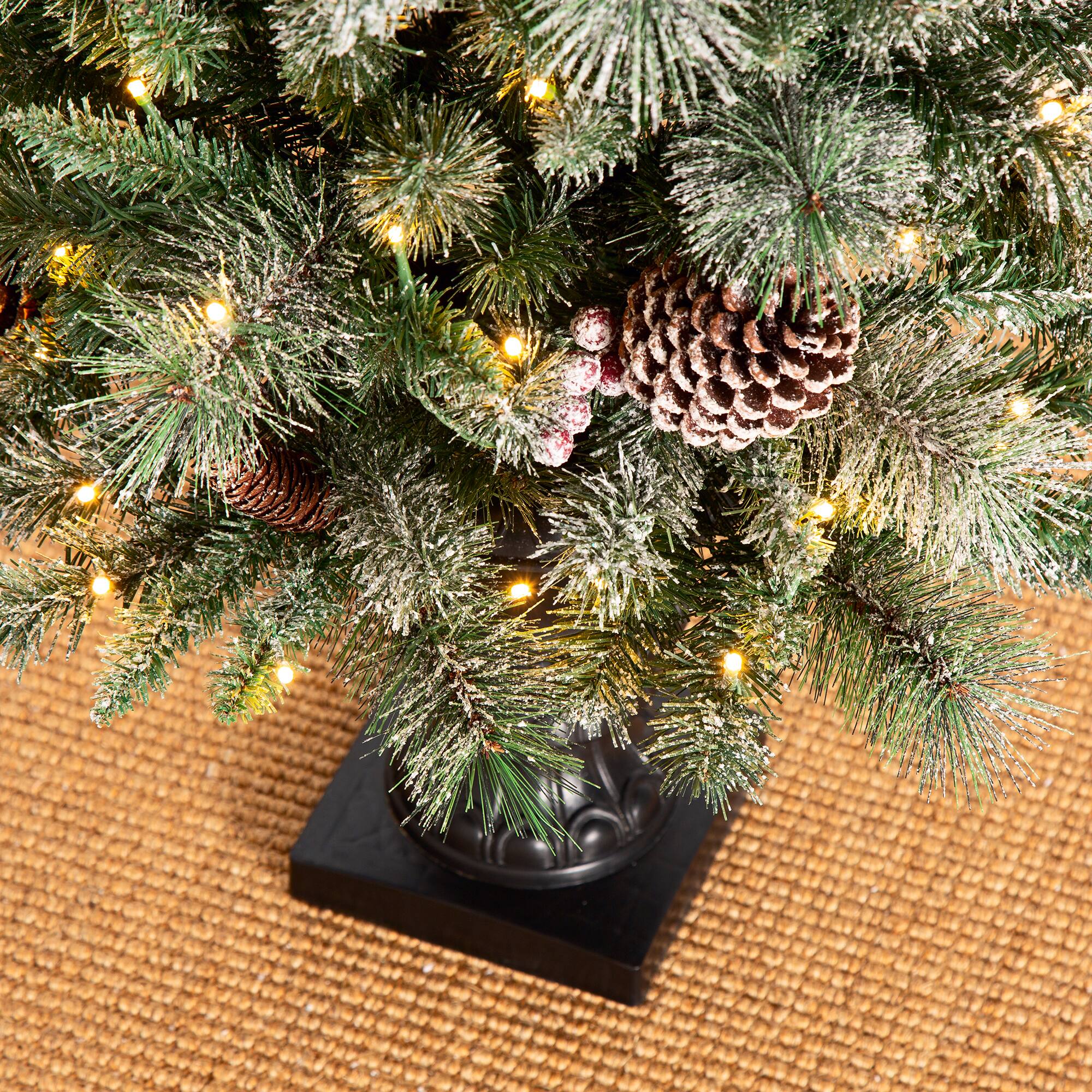 5ft. Pre-Lit Flocked Pine Artificial Christmas Tree in Black Urn, Warm White Lights